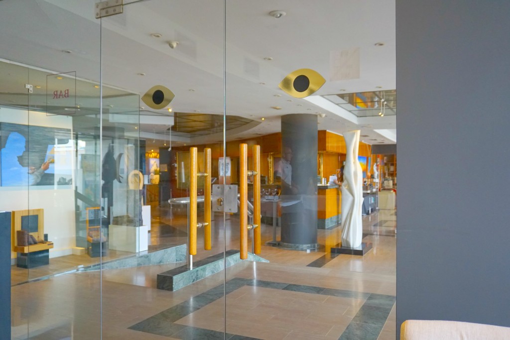 Doors of the Iris Restaurant looking into the lobby of the Estela Hotel in Sitges, Spain