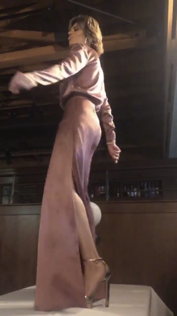 Screenshot of Lisa Rinna dancing on the table at The Palm in Beverly Hills for Andy Cohen's baby shower