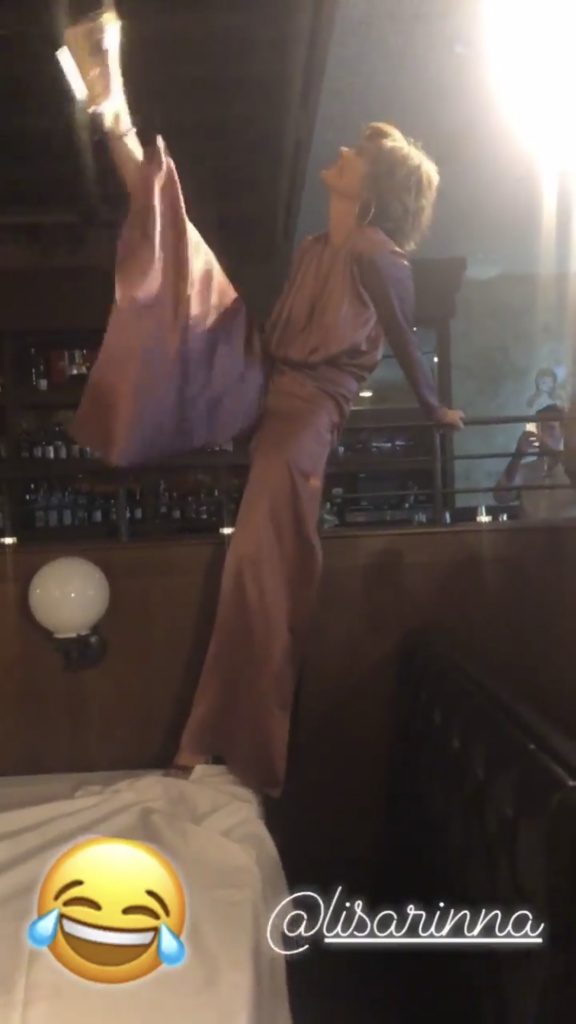 Screenshot of Lisa Rinna doing a split at Andy Cohen's baby shower