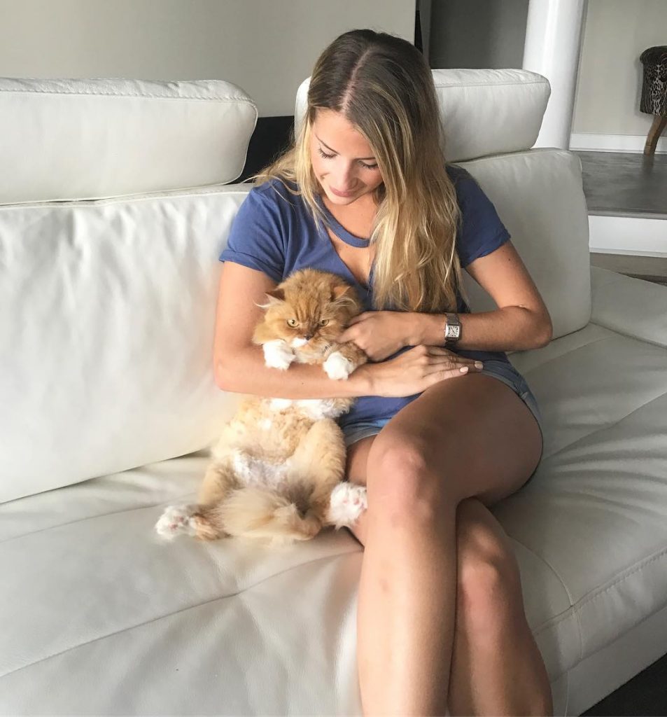 Naomie Olindo and her cat Gizmo