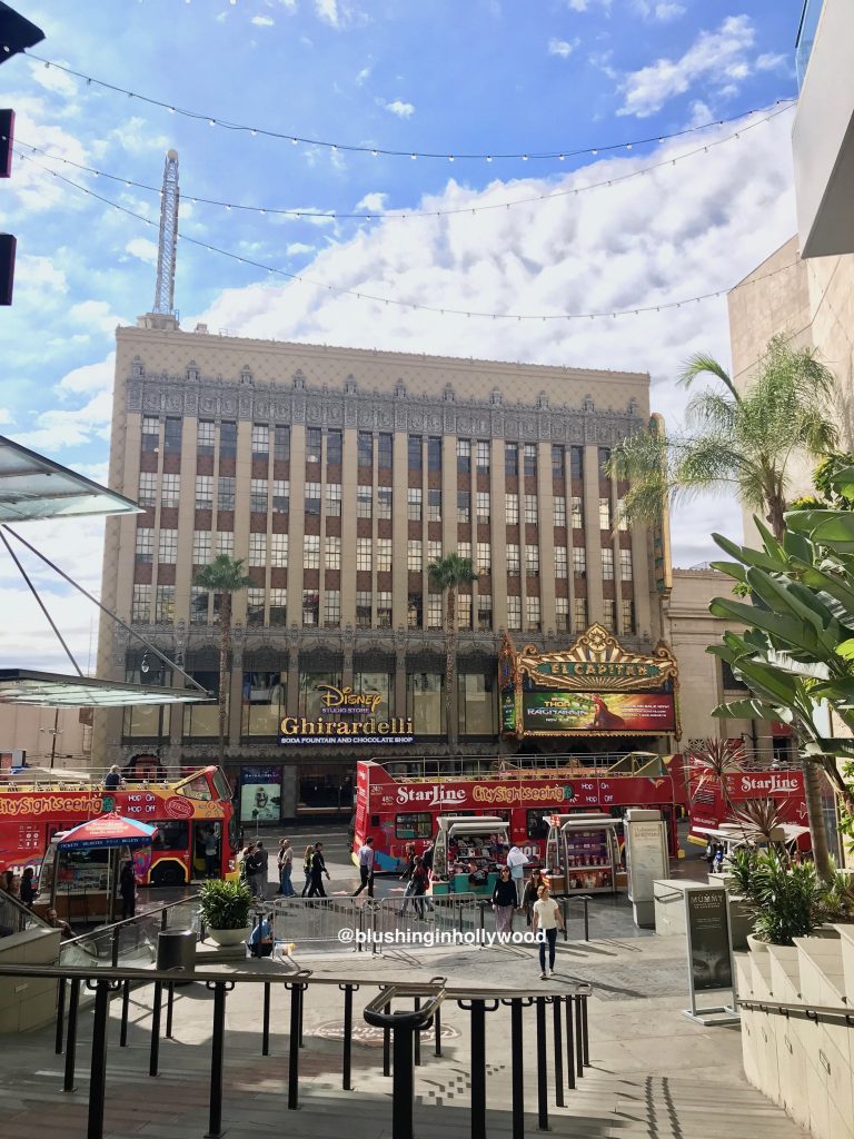 View of Hollywood Blvd, El Capitan Movie Theater, Disney Ghiradelli Store from the Hollywood and Highland Center in Los Angeles, CA