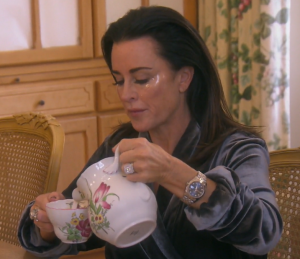 Kyle Richards of Real Housewives of Beverly Hills wearing eye patches at breakfast in Provence