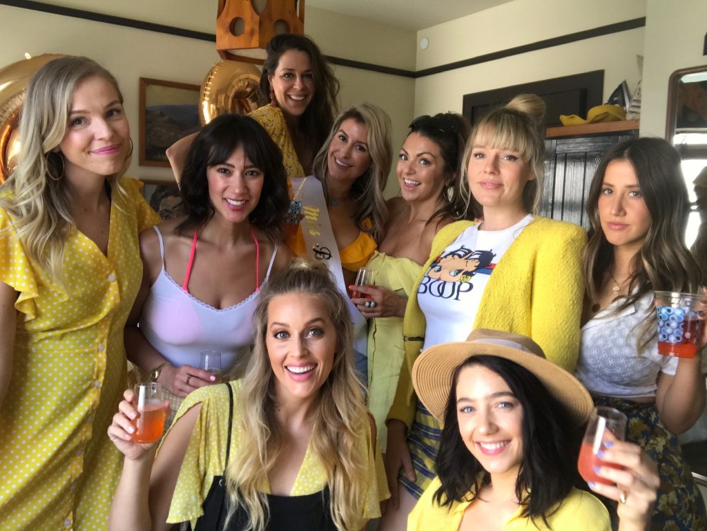 All the girls in Jessica's favorite color yellow for her bachelorette party