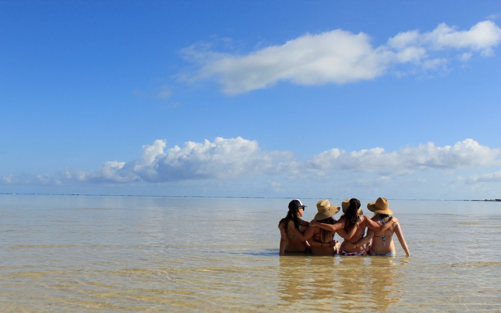 girls on the beach for a tropical bachelorette party