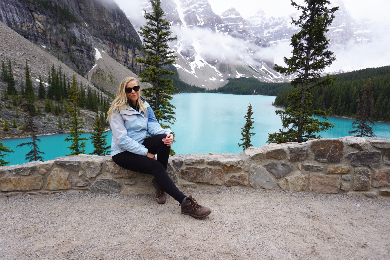 wearing layers at Moraine Lake in Banff, Canada in the summertime