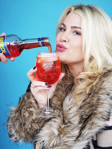 Heather McMahan drinking an Aperol Spritz